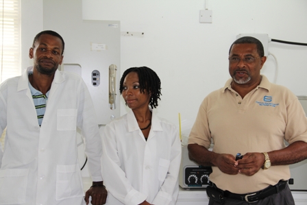 (L-R) Senior Lab Technician at the Nevis Water Department’s Laboratory Mr. Llewellyn Wiltshire, Analyst Mrs. Marsha Smith and General Manager Mr. George Morris at the Water Department’s lab facility in Stoneygrove