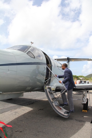 Deputy Premier and Minister of Tourism Hon. Mark Brantley taking a look at an aircraft from Tradewind Aviation’s fleet on the tarmac of the Vance W. Amory International Airport on November 02, 2013