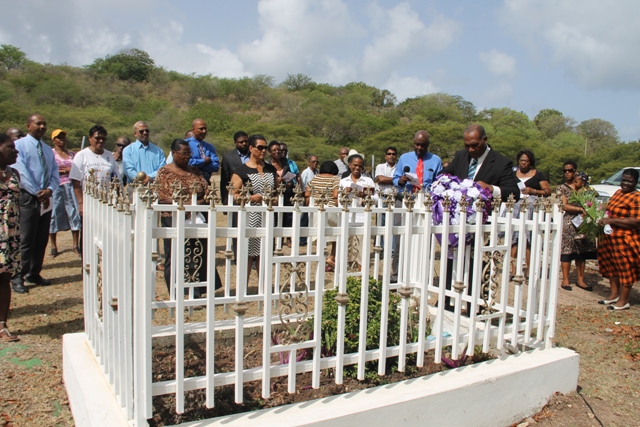 Premier of Nevis Hon. Vance Amory lays a wreath on behalf of the Nevis Island Administration at the grave site of the late Malcolm Guishard at a memorial service at the Bath Cemetery on June 11, 2014, to honour his memory after his passing seven years ago